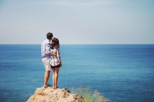 Young couple enjoy beautiful sea view on vacation