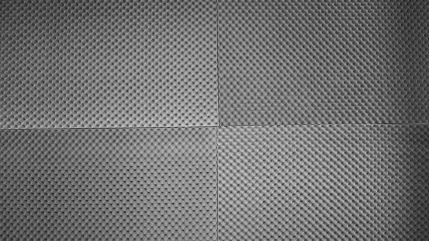 Sound proof padding acoustic soft foam grey color double thick panels layers on the recording studio wall for reduce or absorb or protect this room from other falsetto outside for professional works.