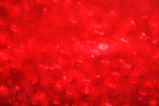 Red bokeh holiday textured glitter background