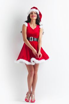 Portrait of beautiful sexy girl wearing santa claus style clothes