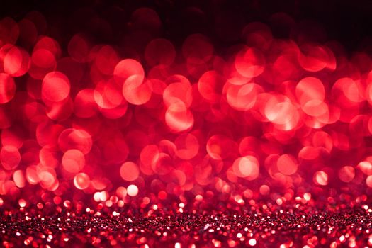 Abstract shining glitters red holiday bokeh background with copy space for text