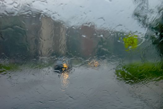 Rain drops on glass with a background.