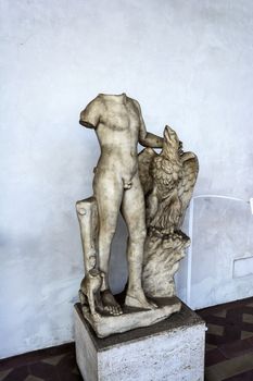 Rome, Italy - September 1, 2017: Ancient sculpture of a man with an eagle in the baths of Diocletian in Rome. Italy