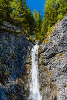 Small water fall in Alps forest, Davos,  Graubuenden, Switzerland