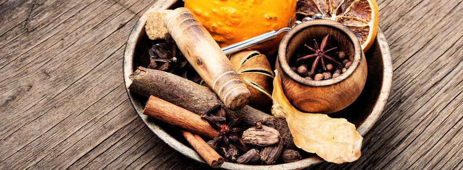 Ingredients for mulled wine on a wooden background.Autumn drink mulled wine