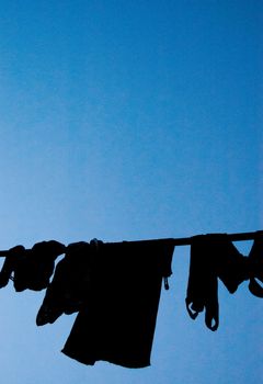Laundory is hang on the balcony in Tokyo, Japan. People usually hang laundries in the morning and put them back to the house in the afternoon.