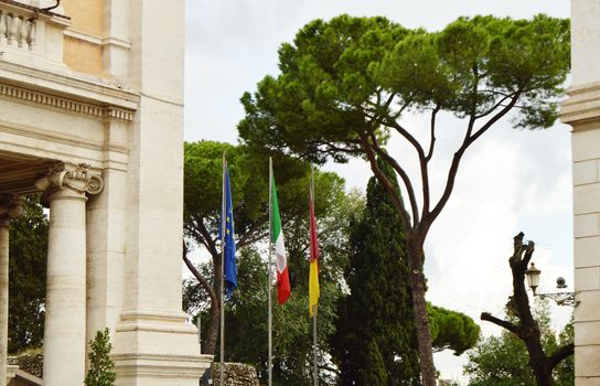 The national flag of Italy, the European Union EU flag of the city of Rome on the flagpole near the city Hall of Rome, on 7 October 2018.