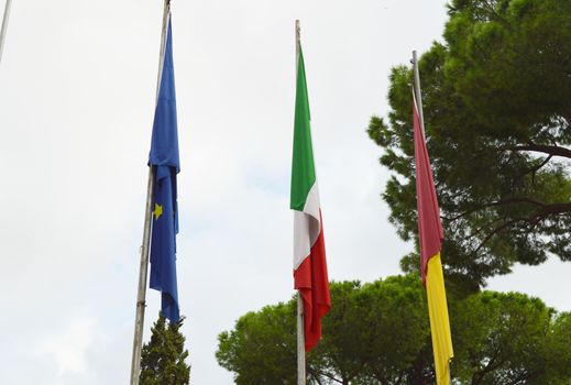 The national flag of Italy, the European Union EU flag of the city of Rome on the flagpole near the city Hall of Rome, on 7 October 2018.