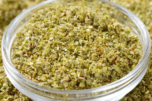 Dried Marjoram leaves in a glass bowl