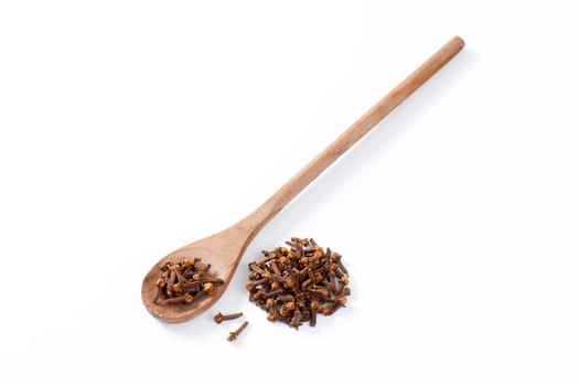 Dried cloves on wooden spoon