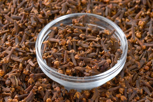 Dried cloves in a glass bowl