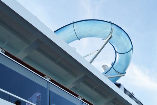View of the transparent tube for entertainment in the water Park on the sea cruise ship, view from the lower deck.