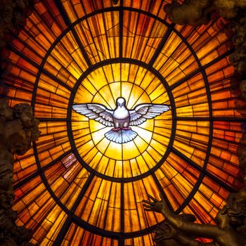 ROME, ITALY - AUGUST 24, 2018: Throne Bernini Holy Spirit Dove Saint Peter's Basilica Vatican Rome Italy. Bernini created Saint Peter's Throne with Holy Spirit Dove Stained Glass Amber in 1600s