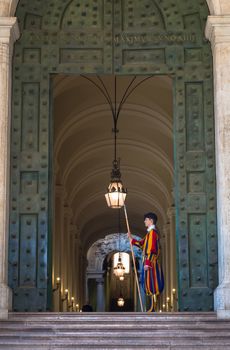 ROME, VATICAN STATE - August 24, 2018: Pontifical Swiss Guard at the entrance of the Vatican State