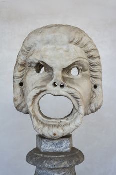 Rome, Italy - September 1, 2017: Death mask scuplture in the baths of Diocletian (Thermae Diocletiani) in Rome. Italy