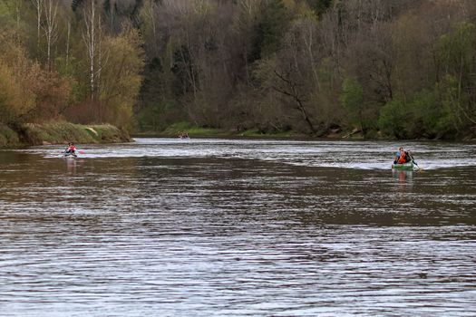 People boating on river Gauja in Latvia, peacefull nature scene.