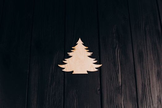 New Year composition with pine tree from plywood. Christmas background for presentation on wooden background holiday