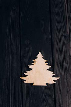 New Year composition with pine tree from plywood. Christmas background for presentation on wooden background holiday