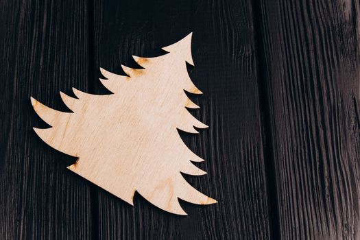 New Year composition with pine tree from plywood. Christmas background for presentation on wooden background holiday