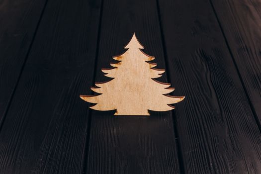 New Year composition with pine tree from plywood. Christmas background for presentation on wooden background holiday