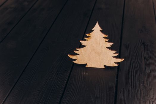 New Year composition with pine tree from plywood. Christmas background for presentation on wooden background holiday