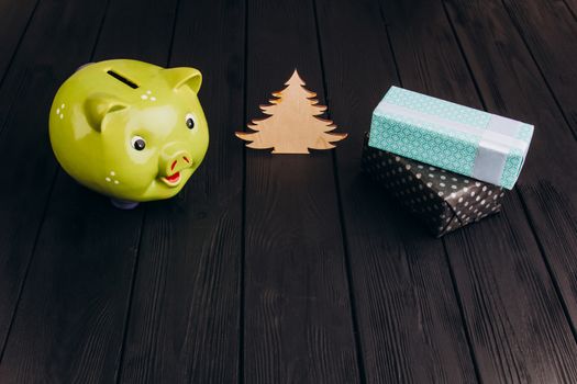 Cute Piggy Bank on the Wooden Table