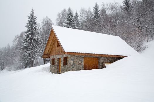 Chalet covered with snow in the French Alps