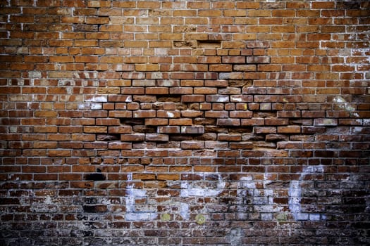 Red brick wall, detail of old wall on the outside