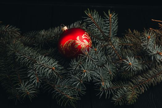 Christmas fir tree branches on wooden table. New year Christmas background with copy space. Greeting card.