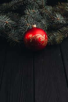 Christmas fir tree branches on wooden table. New year Christmas background with copy space. Greeting card.