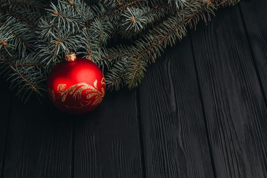 Christmas fir tree branches on wooden table. New year Christmas background with copy space. Greeting card.