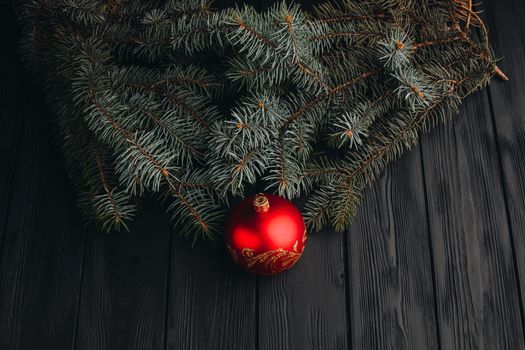 Christmas fir tree branches on wooden table. New year Christmas background with copy space. Greeting card.