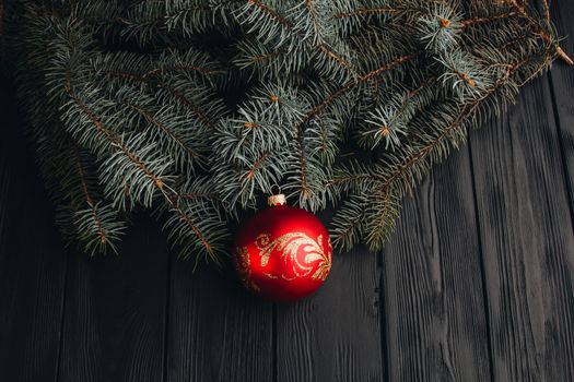 Christmas fir tree branches on wooden table. New year Christmas background with copy space. Greeting card.