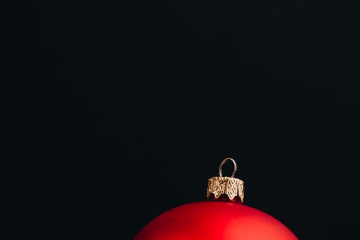 Christmas New Year decoration composition. Top view of fur-tree branches and balls frame on wooden background with place for your text.