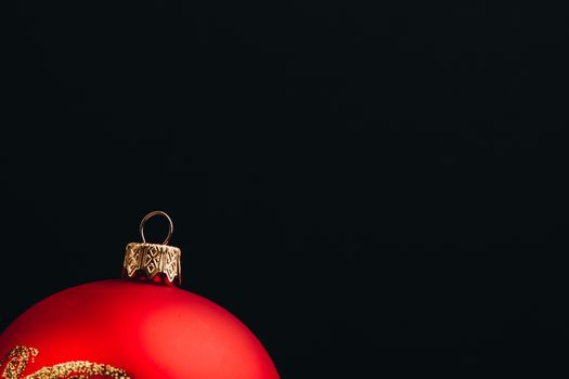 Christmas New Year decoration composition. Top view of fur-tree branches and balls frame on wooden background with place for your text.