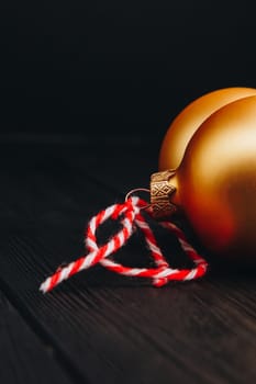 Colored christmas decorations on black wooden table. Xmas balls on wood background. Top view, copy space. new year