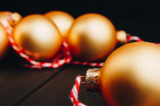 Colored christmas decorations on black wooden table. Xmas balls on wood background. Top view, copy space. new year