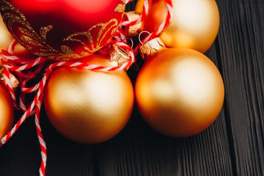 Colored christmas decorations on black wooden table. Xmas balls on wood background. Top view, copy space. new year