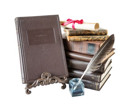 Old hardcover brown books, feather pen in inkpot, bookrest and scroll tied with red bow, isolated on white background