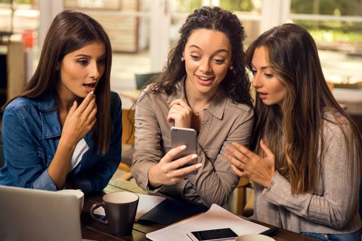 Group of girls making a pause on the studies for some gossip