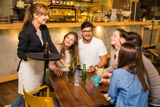 A group of friends making a order at cafe 