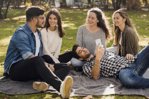 Group of friends having  a great day in the park