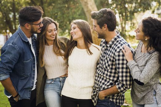 Group of friends having  a great day in the park