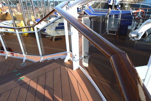 View of the wooden stairs on the open deck of a luxury cruise liner.