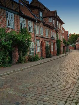 Half-timbered red brick houses near the river on the old harbor Lueneburg, Germany