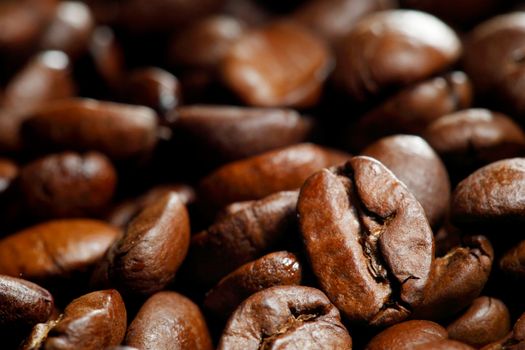 Fresh roasted coffee beans close-up background