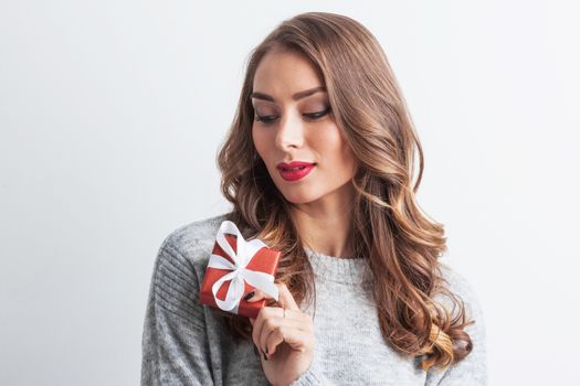 Woman hold christmas or new year decorated gift box