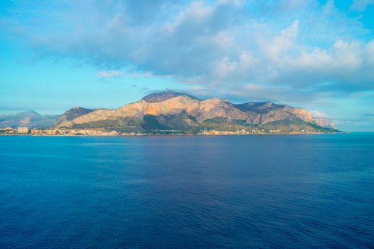 Beautiful sunrise over Palermo, panorama of the city from the sea.