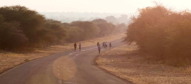 People walking at the side of the road, Namibia