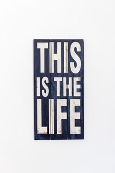 This Is The Life Printed/ Painted on rustic black  wooden surface and white lettering, isolated on white background